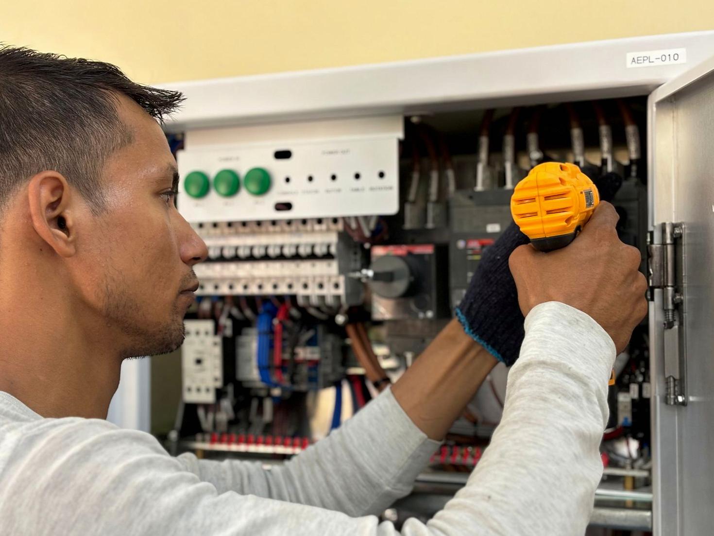 Professional electrician working on a switchboard in Adelaide